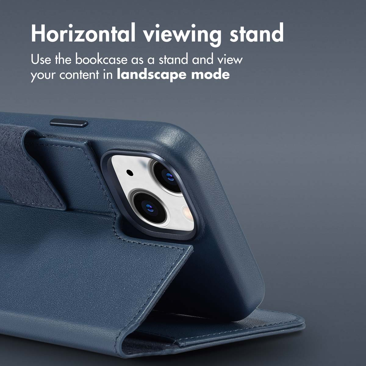 A dark blue smartphone leather case stand against a grey background, showing horizontal viewing.