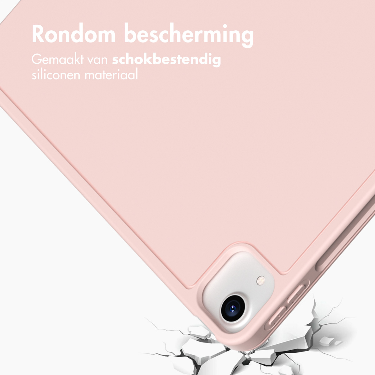 Roze siliconen tablet hoes met ingebouwde bescherming boven een gebarsten ondergrond.