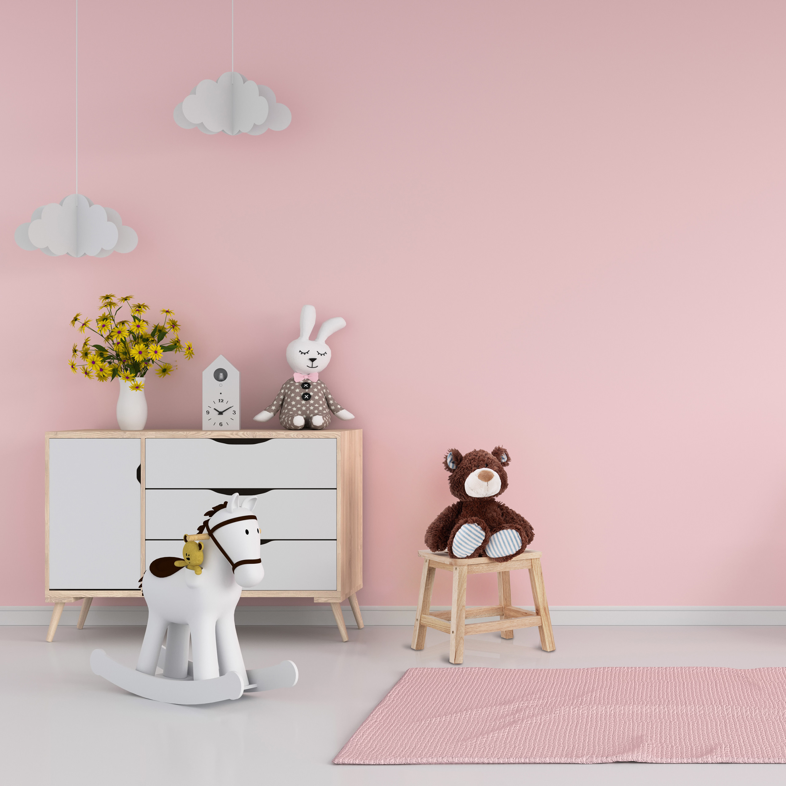 Rosa Kinderzimmer mit weißem Schrank, Schaukelpferd, Plüschtieren und hängenden Wolken.