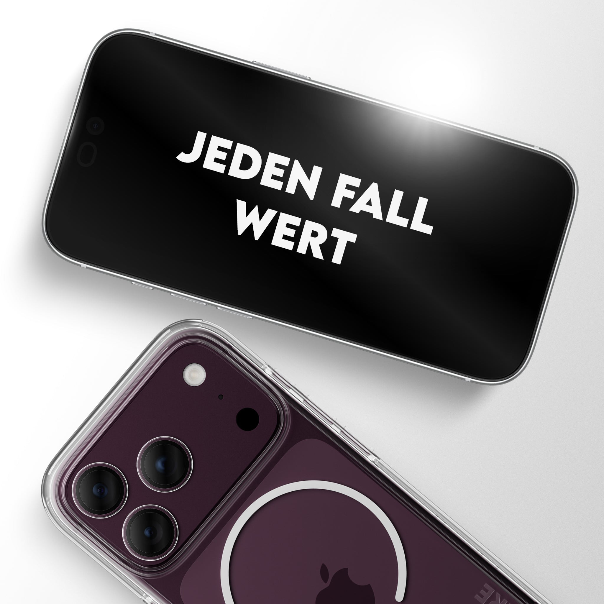 Beyaz arka planda iki akıllı telefon, birinde "JEDEN FALL WERT" yazısı ve diğerinde şeffaf kılıflı mor arka kısım var.