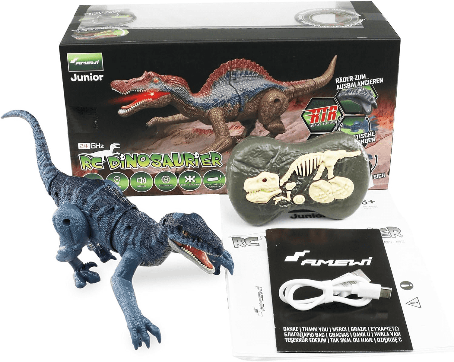 Un dinosaurio de juguete azul teledirigido con su caja, mando, manual y cable USB sobre una superficie blanca.