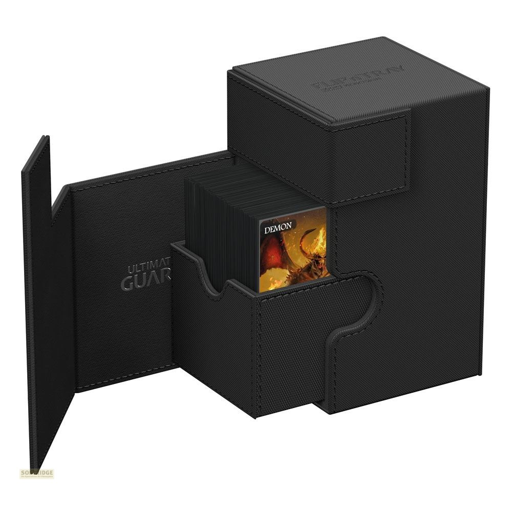 Une boîte de cartes noire Ultimate Guard ouverte, révélant un jeu de cartes avec une illustration de démon.