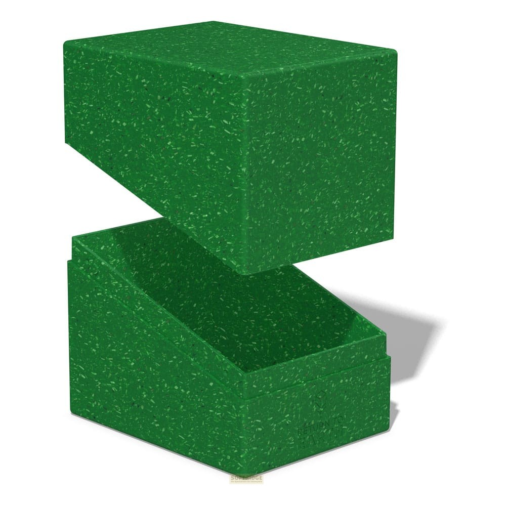 Une boîte de rangement verte et mouchetée avec le couvercle soulevé sur fond blanc.