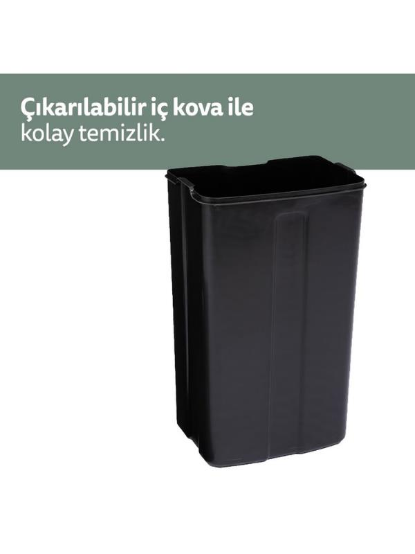 Üst kısmında metin bulunan siyah dikdörtgen çöp kovası.