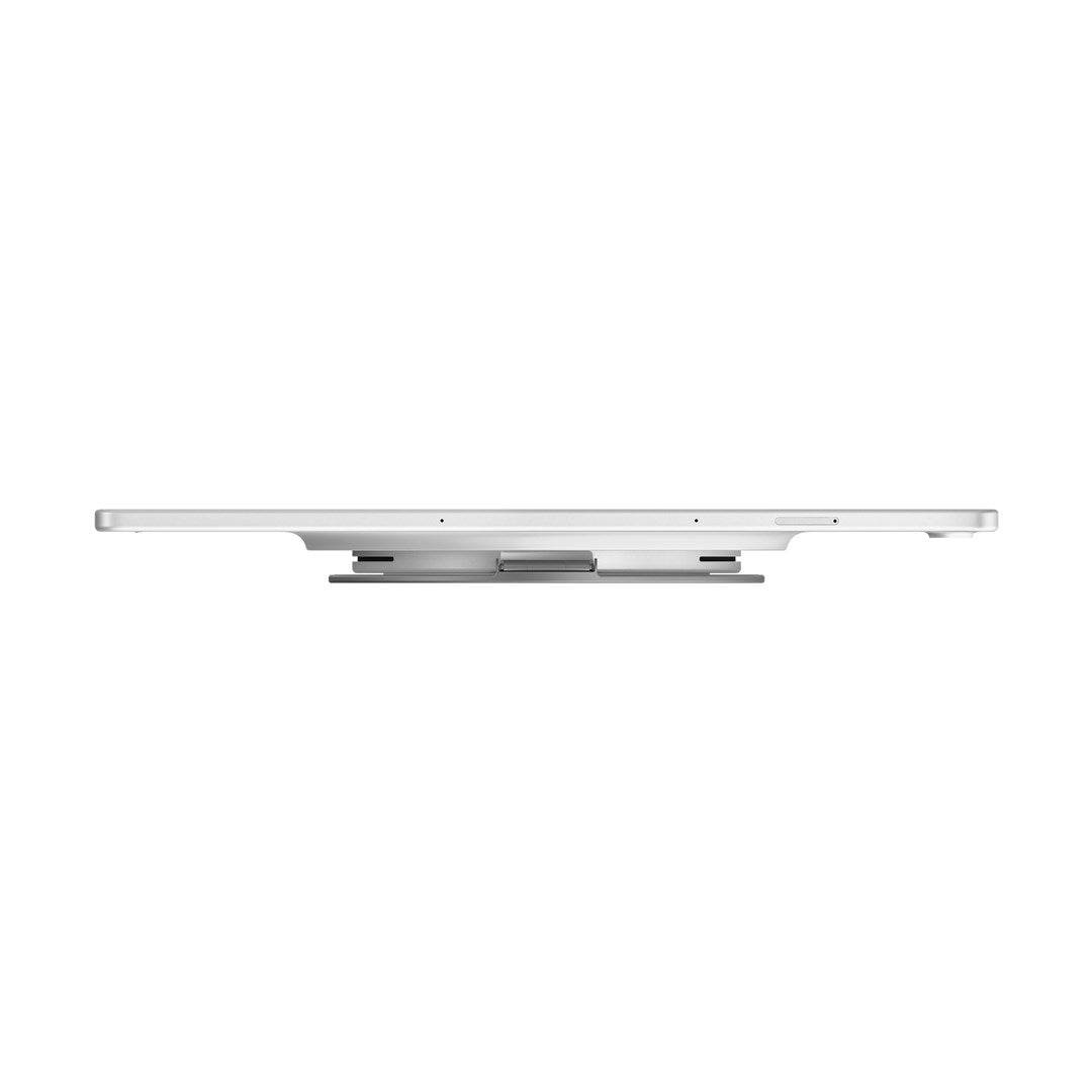 Vista laterale di un tablet argento con supporto circolare integrato su sfondo bianco.