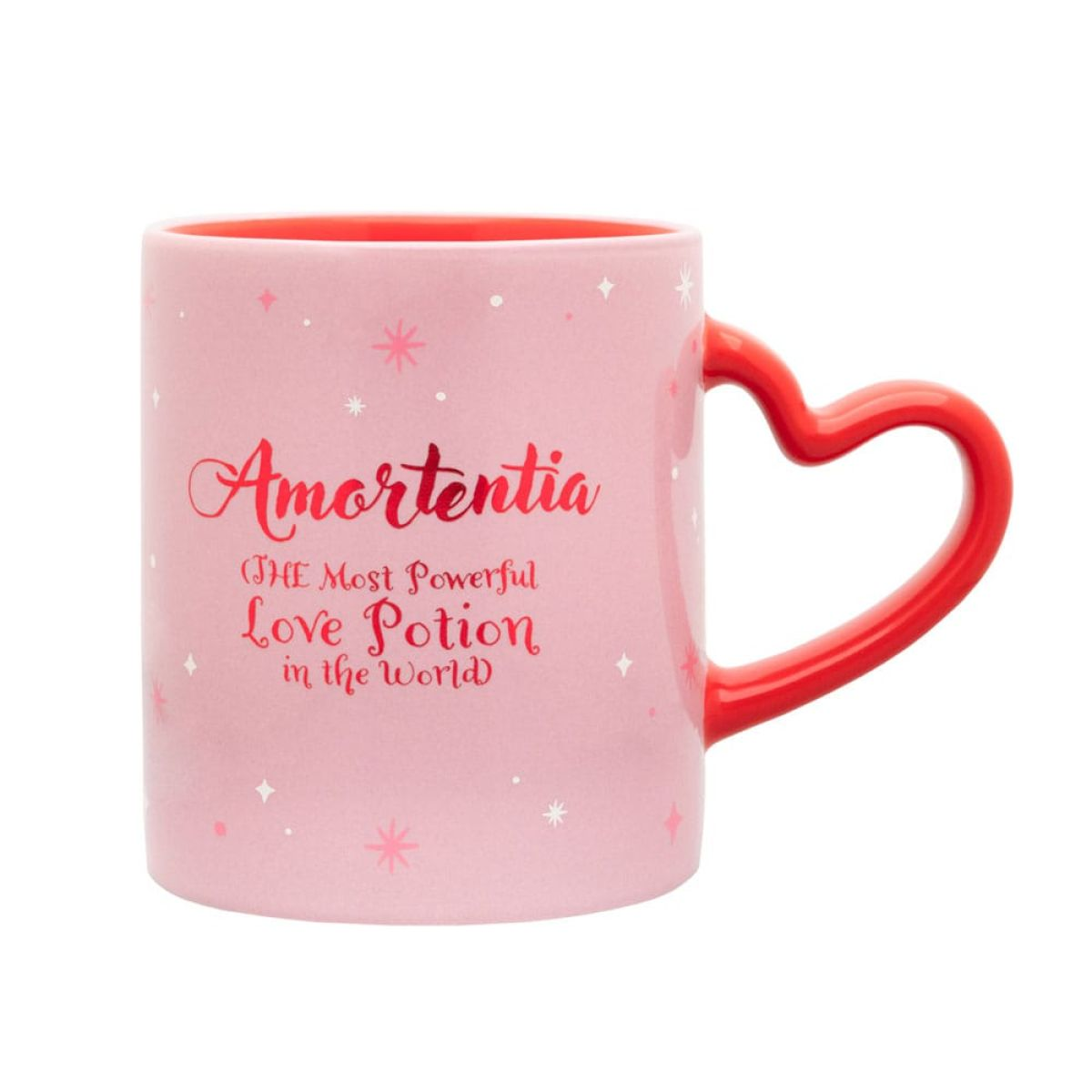 Una taza rosa con asa de corazón y texto de Amortentia sobre fondo blanco.