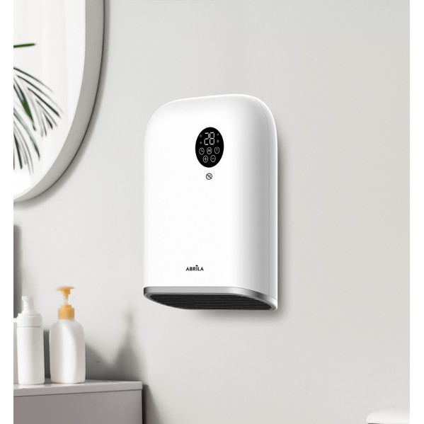 Un calefactor de pared blanco con panel digital está instalado en un baño junto a dispensadores de jabón.