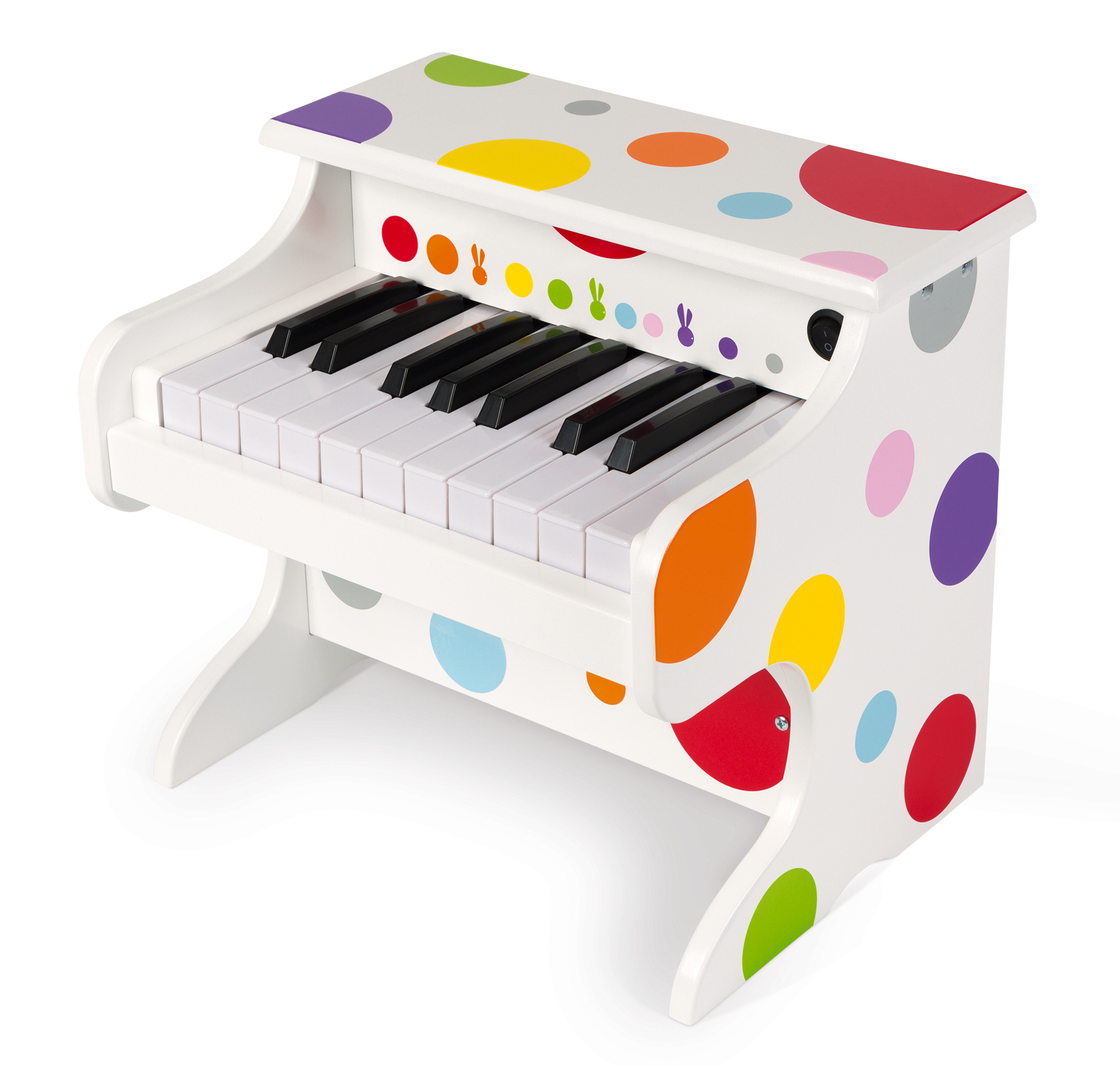 Un petit piano jouet en bois blanc décoré de pois colorés sur le dessus et les côtés.