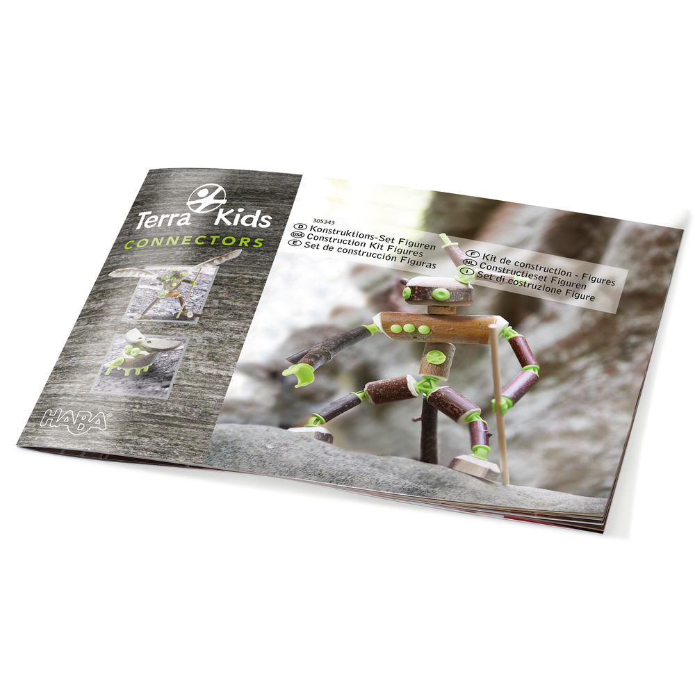 Anleitungsheft für Terra Kids Connectors mit einer Holzfigur aus Zweigen auf Steinen.