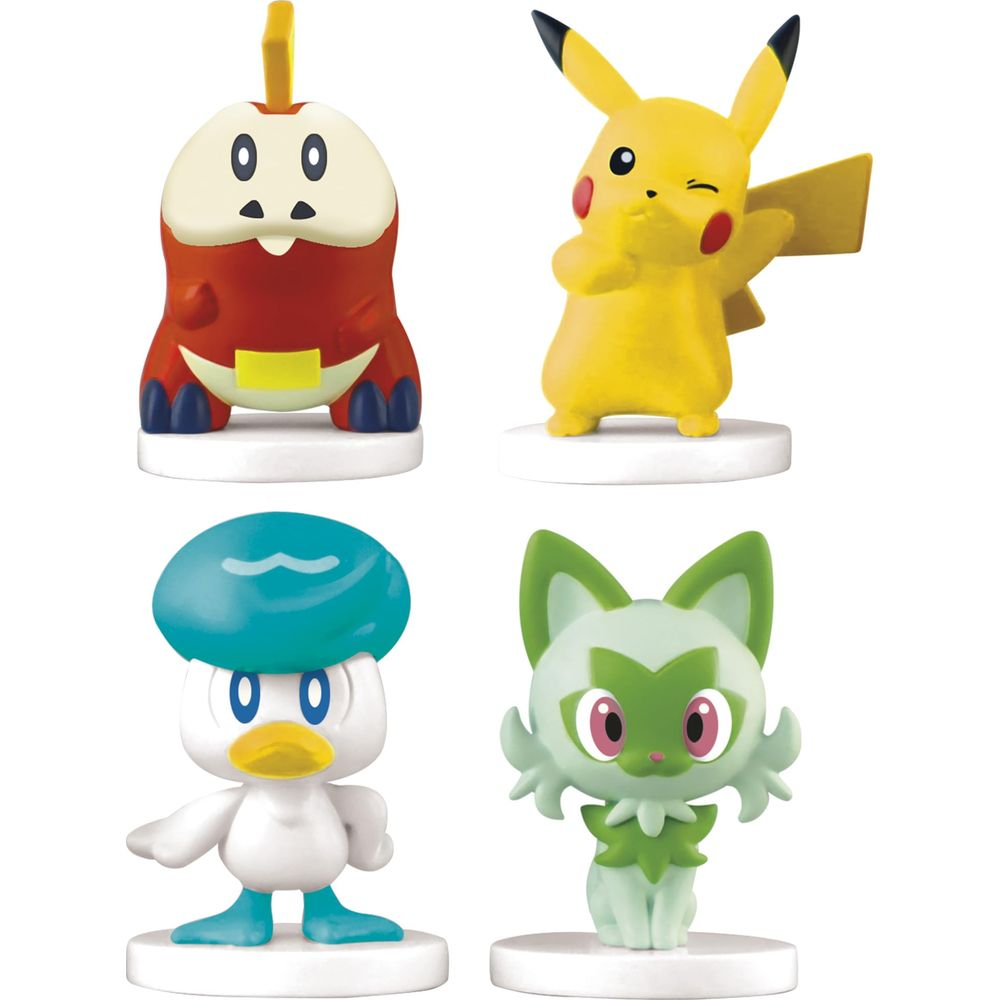 Vier bunte Pokémon-Figuren auf runden, weißen Sockeln vor weißem Hintergrund.