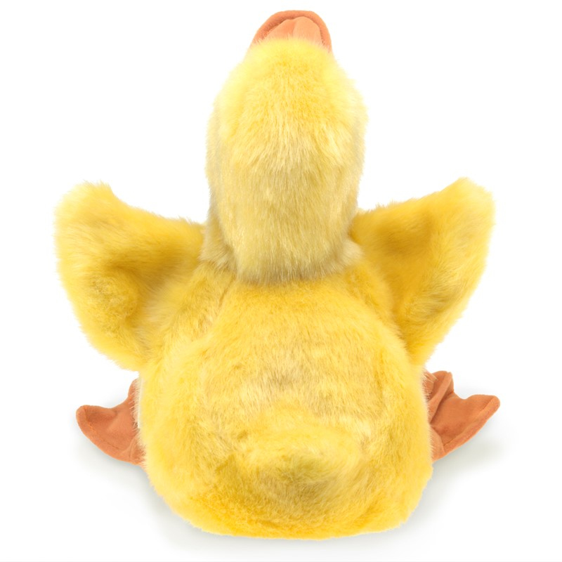Rückansicht einer flauschigen gelben Plüschente mit orangem Schnabel und Füßen vor weißem Hintergrund.