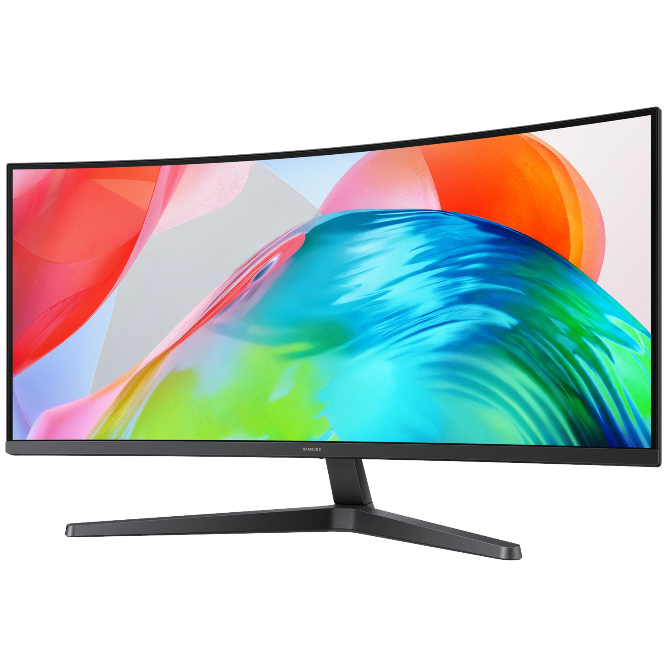 Un ampio monitor Samsung curvo mostra una grafica colorata astratta con onde rosse, blu e verdi su sfondo chiaro.