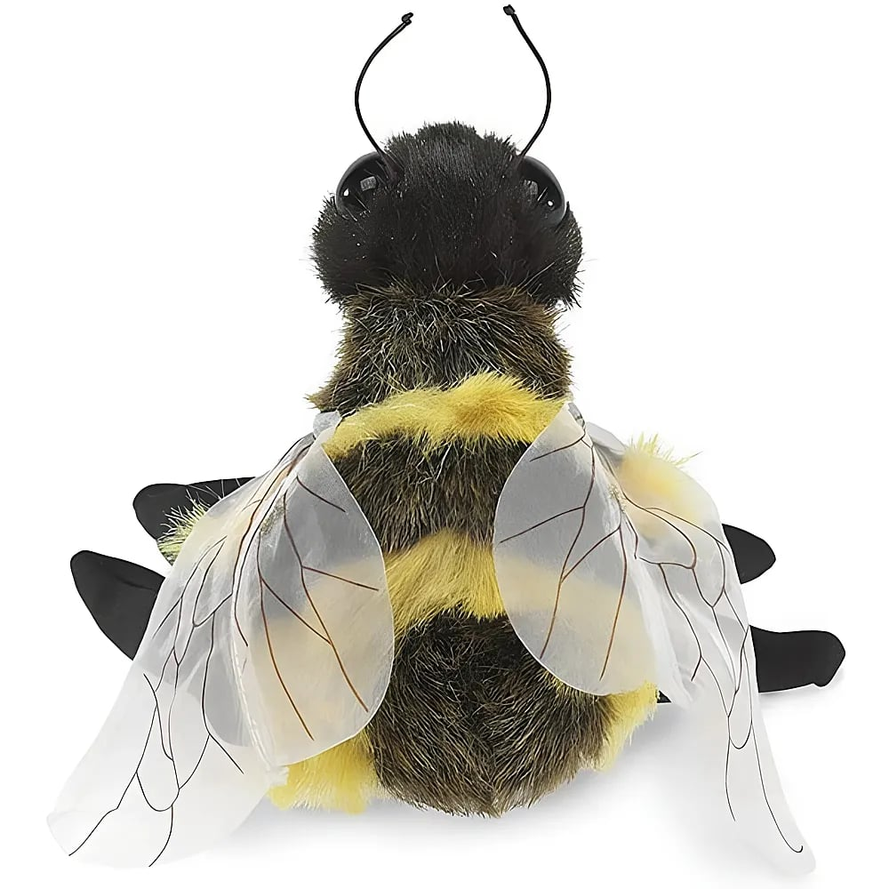 Un bourdon en peluche poilu avec des rayures jaunes et noires, de grands yeux noirs et des ailes translucides.