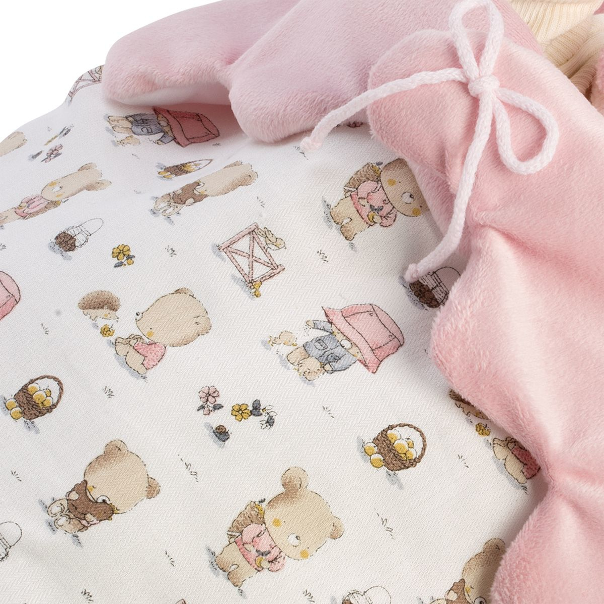 Tessuto di peluche rosa su tessuto bianco con simpatico motivo di orsetti.
