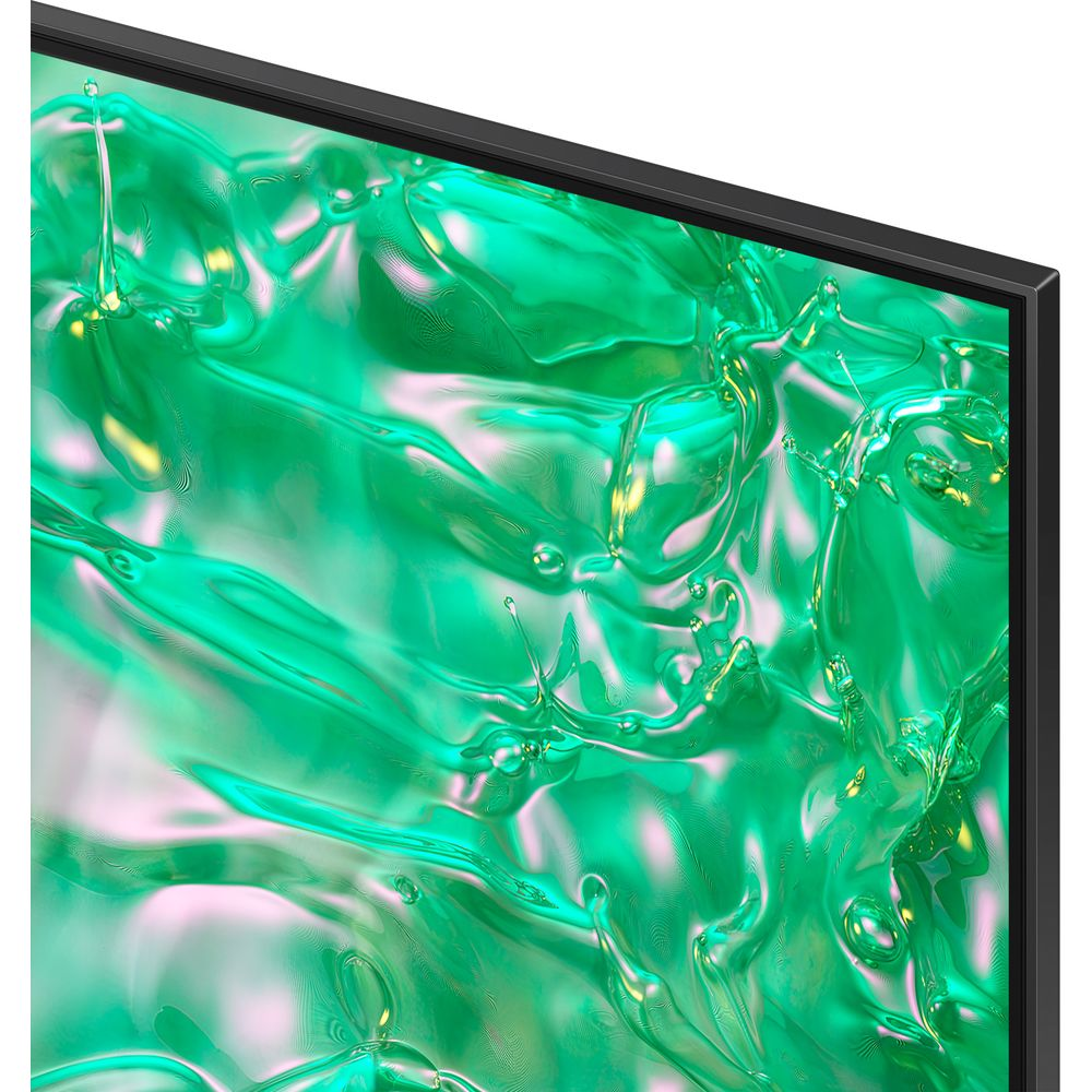 Un téléviseur affiche une surface liquide verte brillante et abstraite avec des reflets lumineux.