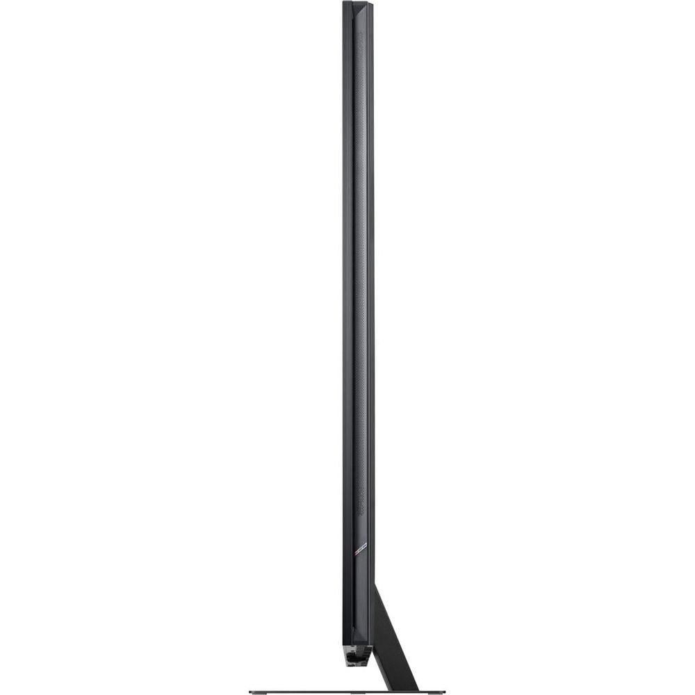 Vue latérale d'un téléviseur noir mince sur un support plat.