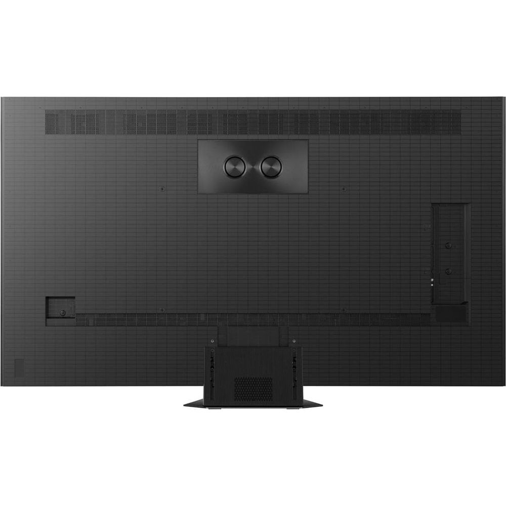 Vue arrière d'un téléviseur plat noir, montrant son motif de grille, ses haut-parleurs centraux et son pied.