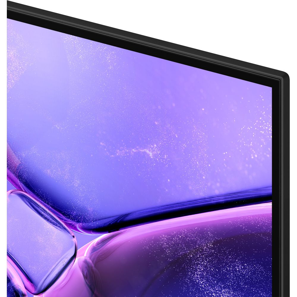 Gros plan sur un écran de télévision affichant un motif abstrait et scintillant violet et bleu.