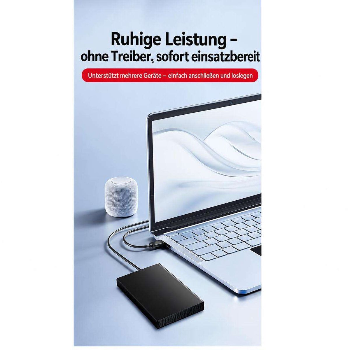 Laptop mit angeschlossener externer Festplatte und Lautsprecher auf einem Tisch, mit Text darüber.