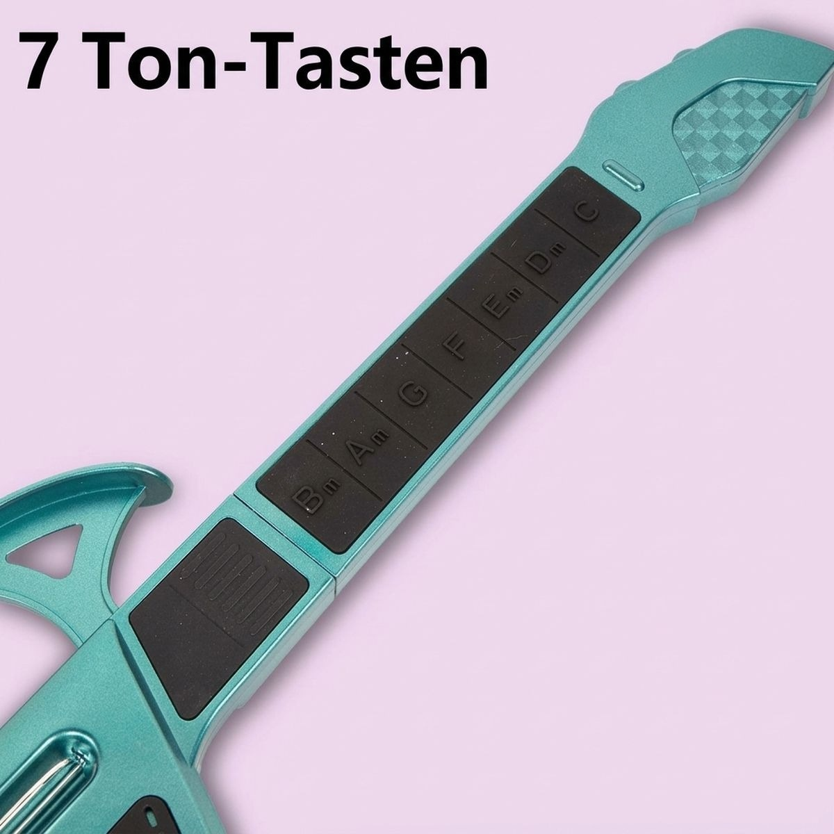 Ein türkisfarbenes Musikinstrument mit schwarzen Tasten und dem deutschen Text '7 Ton-Tasten' oben links auf pinkem Hintergrund.