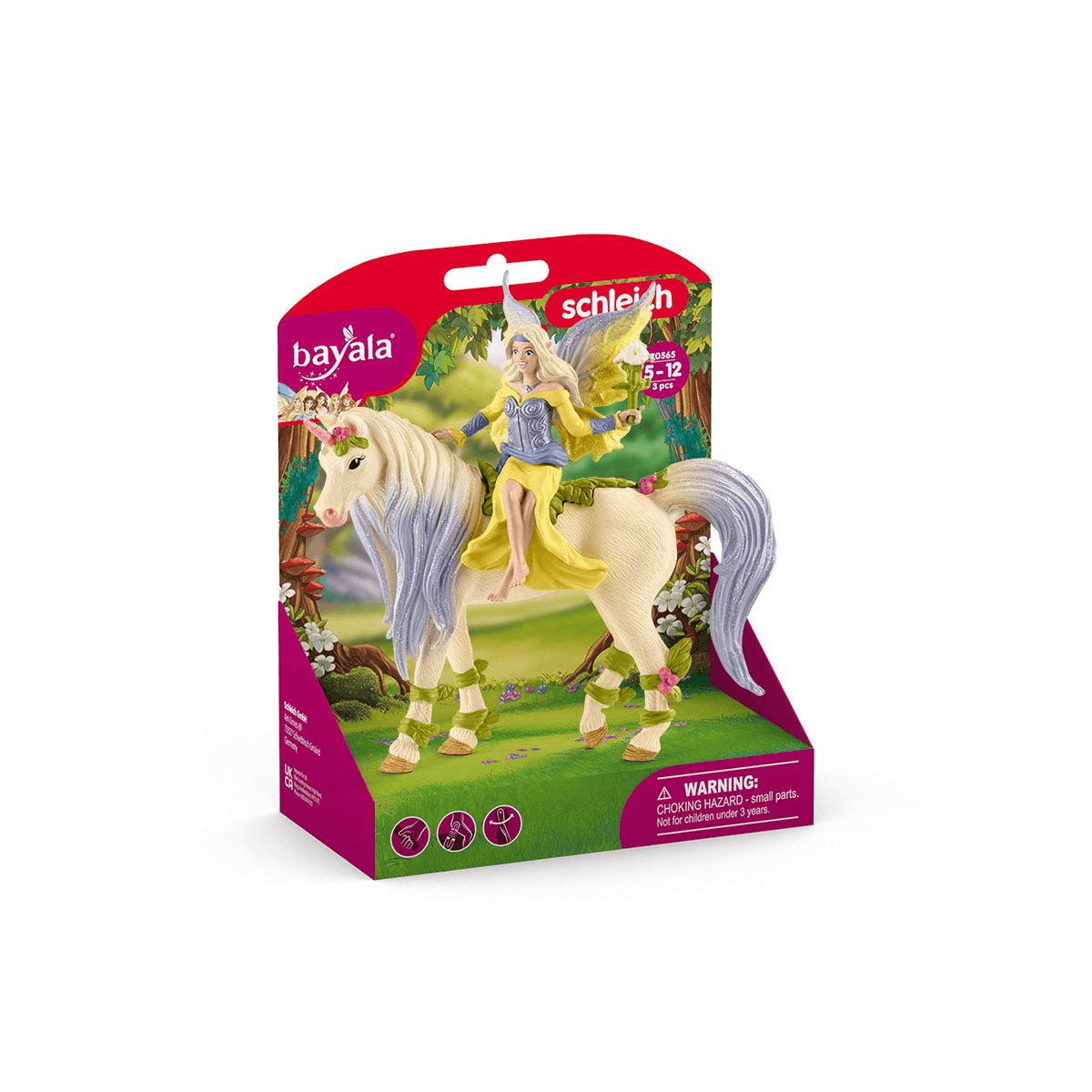Una figura de hada Schleich Bayala con un unicornio en su empaque original sobre un fondo verde.