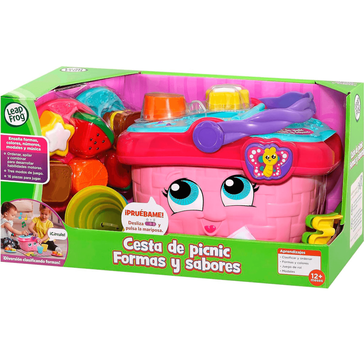Cesta de picnic de juguete con grandes ojos azules y comida de juguete colorida en un empaque verde.