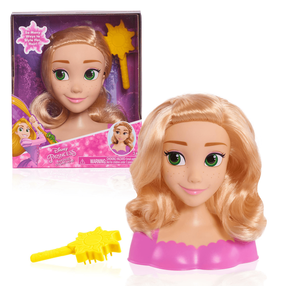 Cabeza de peinado de Rapunzel con cabello rubio, top rosa, cepillo amarillo y caja a juego sobre fondo blanco.