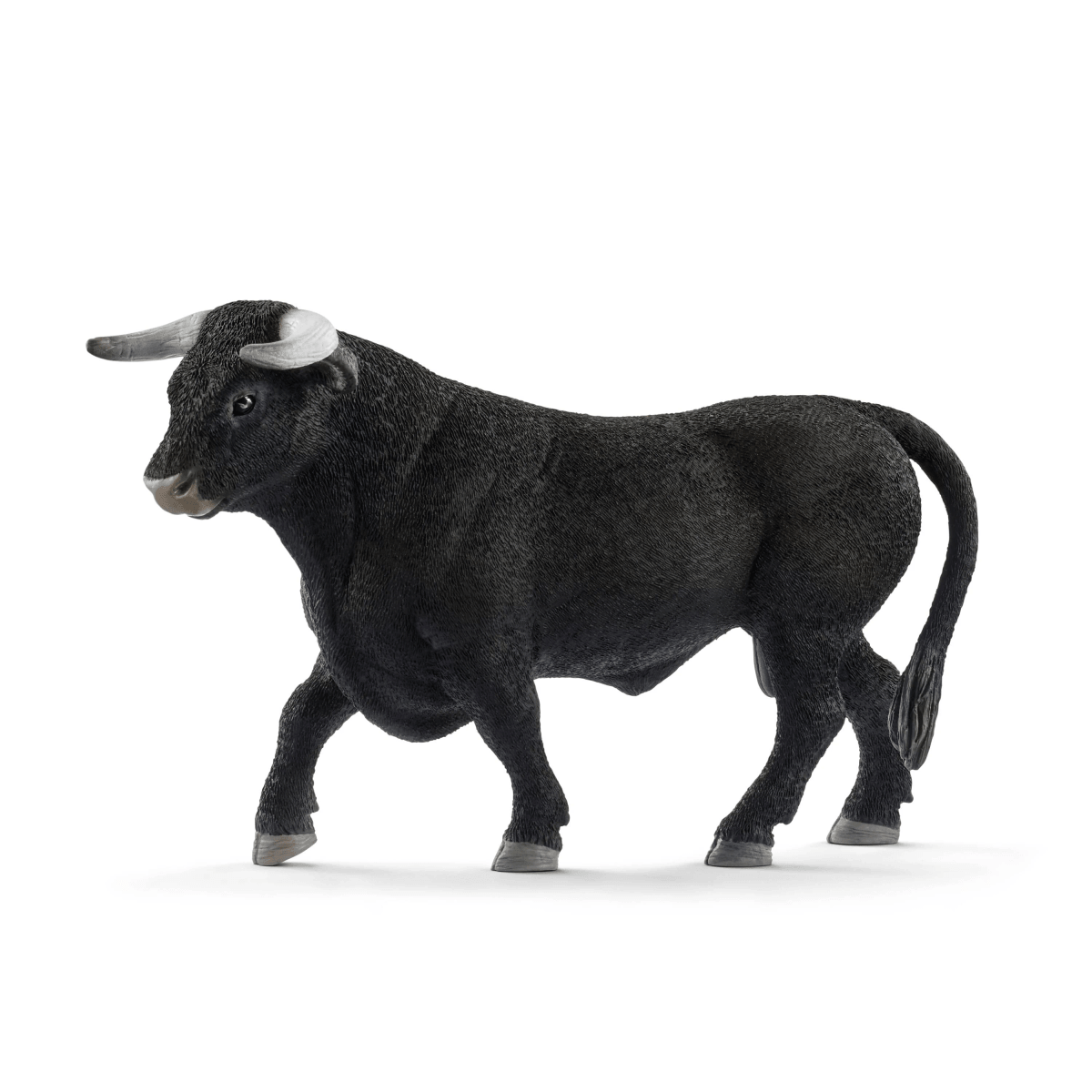 Una figura de toro negro con cuernos y pezuñas grises sobre fondo blanco.