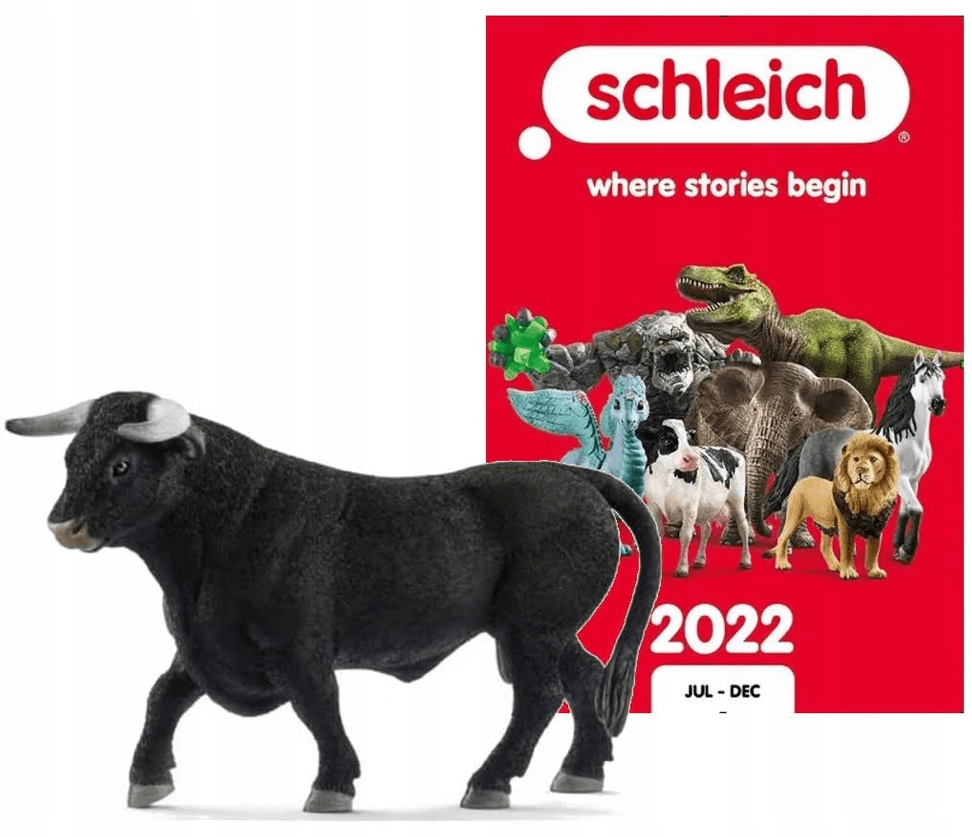 Figura de toro Schleich frente a un catálogo rojo de 2022 con juguetes de animales.