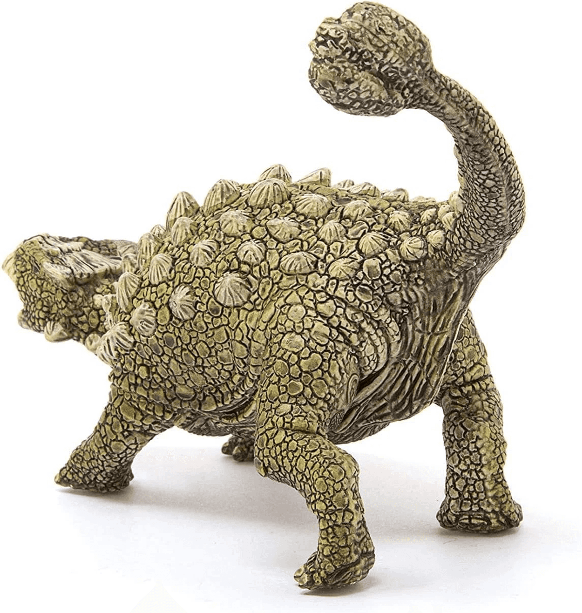 Detallada estatuilla de piedra de un anquilosaurio con espalda acorazada y cola en maza sobre fondo blanco.