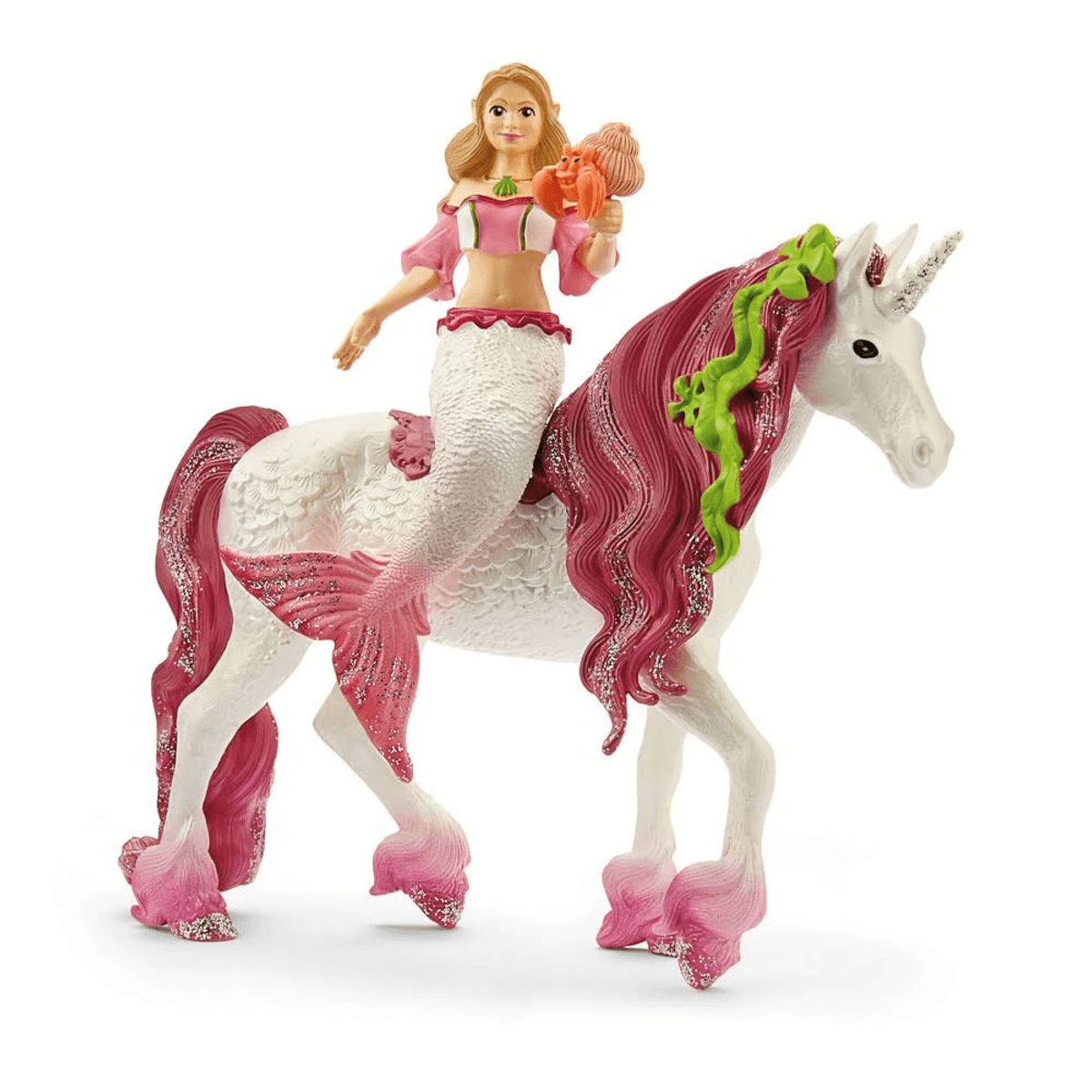 Eine Elfe mit Fischschwanz reitet auf einem glitzernden Einhorn mit pinker Mähne.