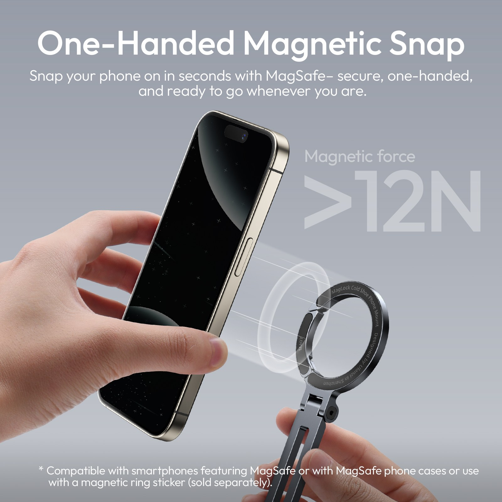 Hand hält ein Smartphone und eine magnetische Halterung mit Kraft von über 12N auf grauem Hintergrund.