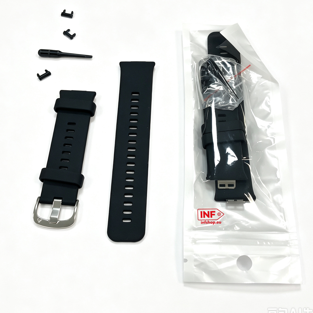 Schwarzes Uhrenarmband mit Werkzeug und Pins auf weißem Hintergrund und in Plastikverpackung.