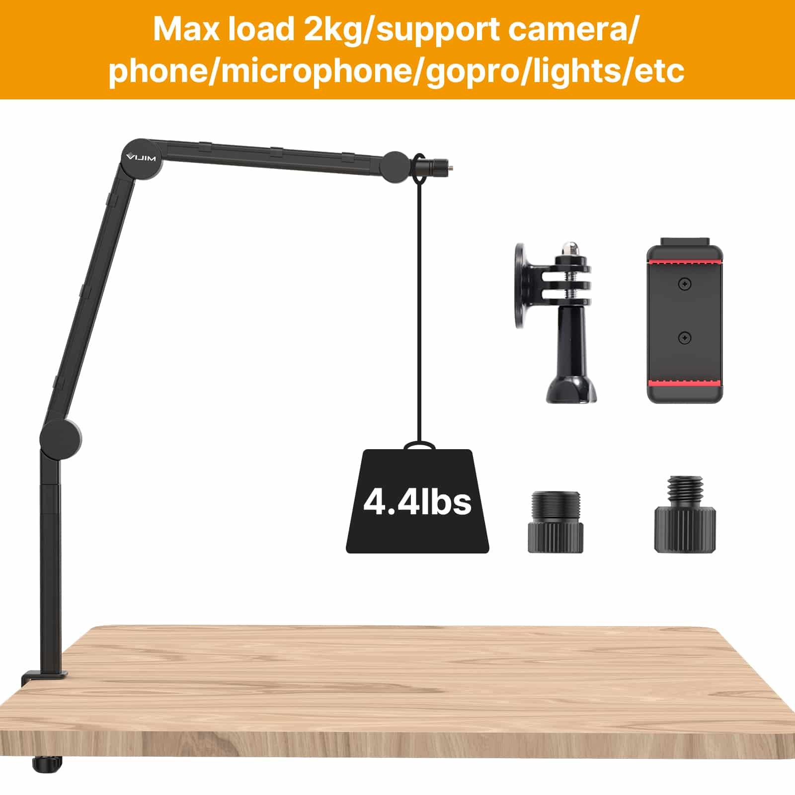 Un bras de bureau noir supportant un poids de 4,4 lbs et des accessoires sur une surface en bois.