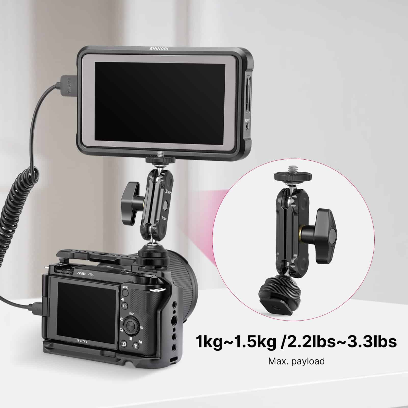 Kamera z monitorem połączona regulowanym ramieniem. Tekst pokazuje maks. udźwig od 1kg do 1.5kg.