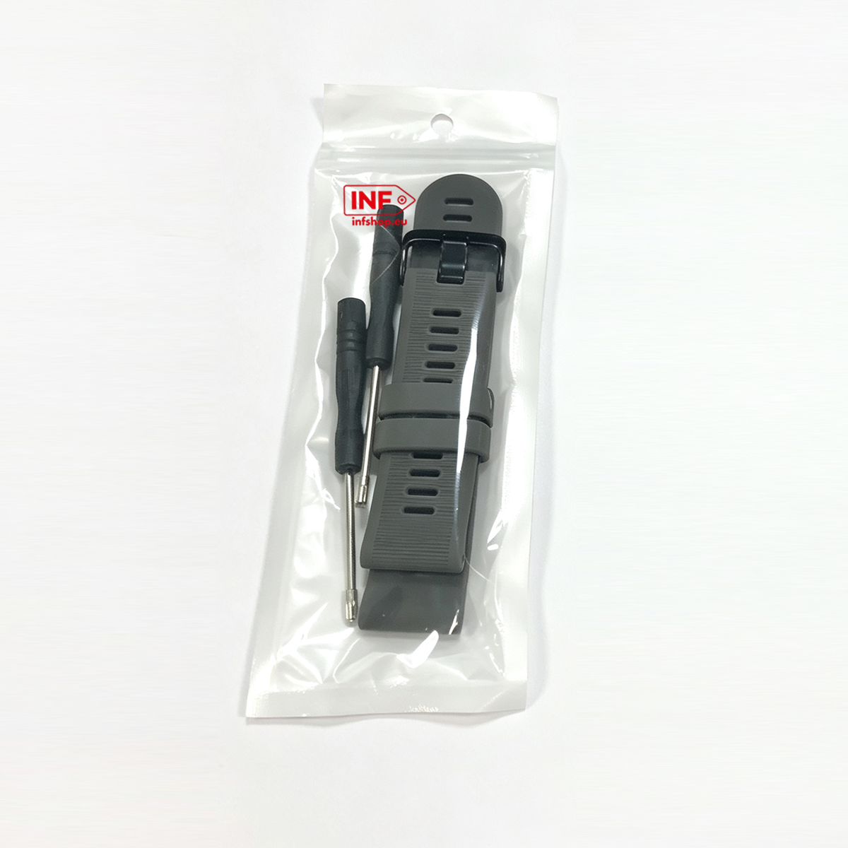 Een grijze horlogeband en twee schroevendraaiers in een verzegelde plastic zak.