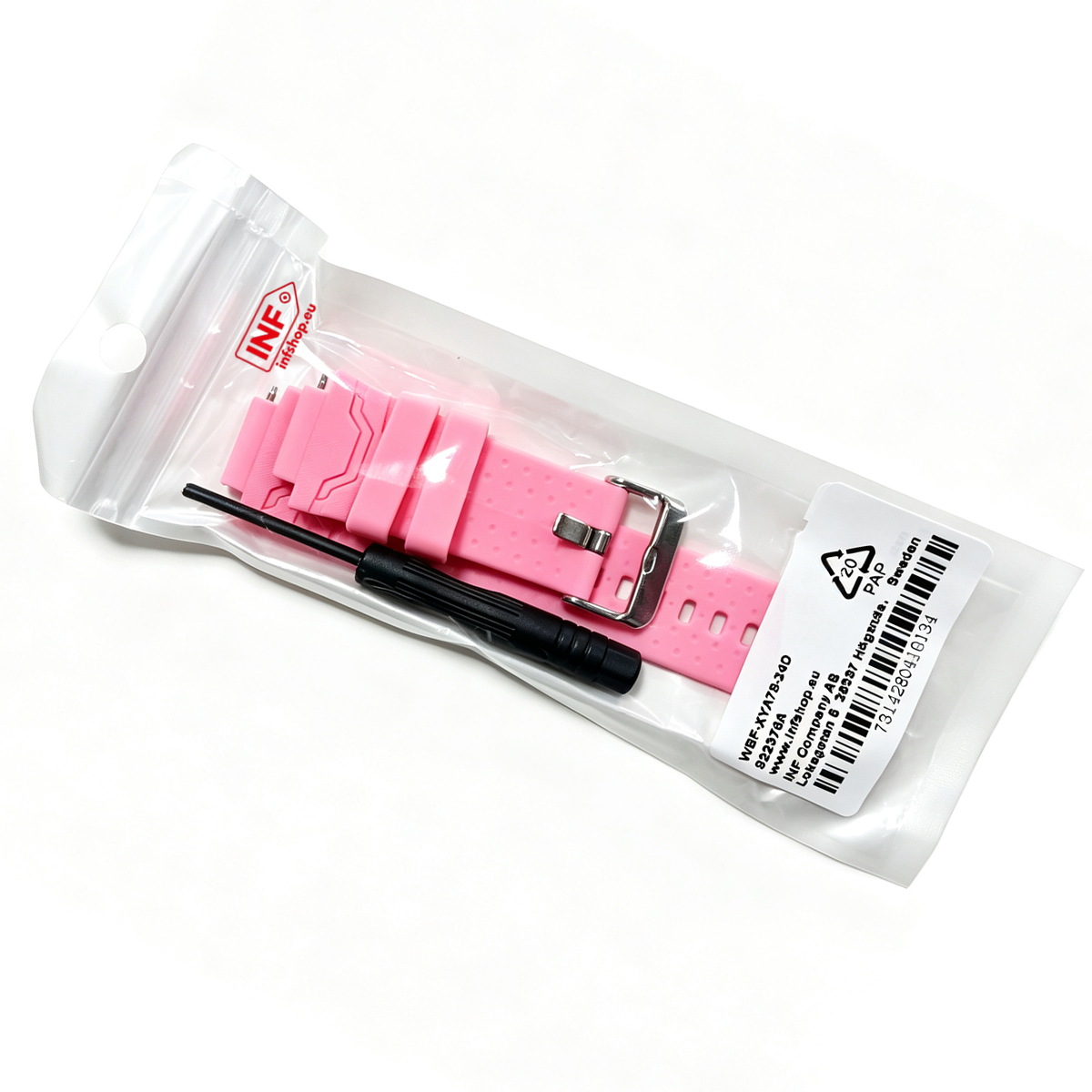 Rosa Silikon-Uhrenarmband und kleiner schwarzer Schraubendreher in einem klaren Plastikbeutel auf weißem Grund.