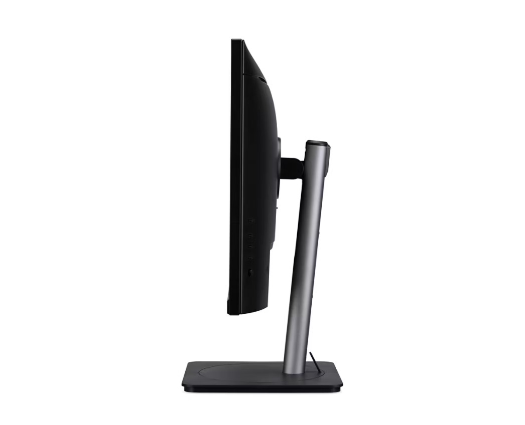 Vista laterale di un monitor per computer nero con supporto argentato su base piatta.