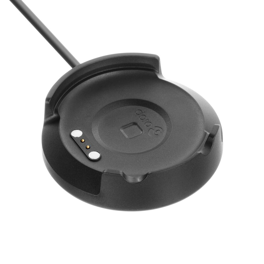 Una base di ricarica circolare nera con cavo collegato e tre pin di contatto metallici su sfondo bianco.
