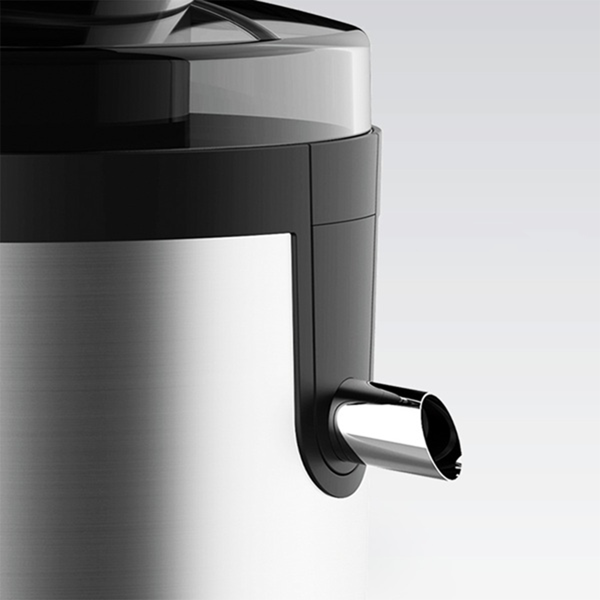 Primo piano di una moderna macchina da caffè con corpo metallico, parte superiore nera e beccuccio lucido.