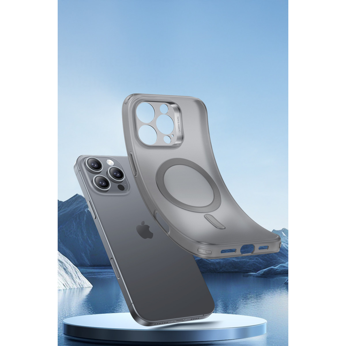 Kılıflı gri bir akıllı telefon, mavi bir dağ manzarasının önünde süzülüyor.