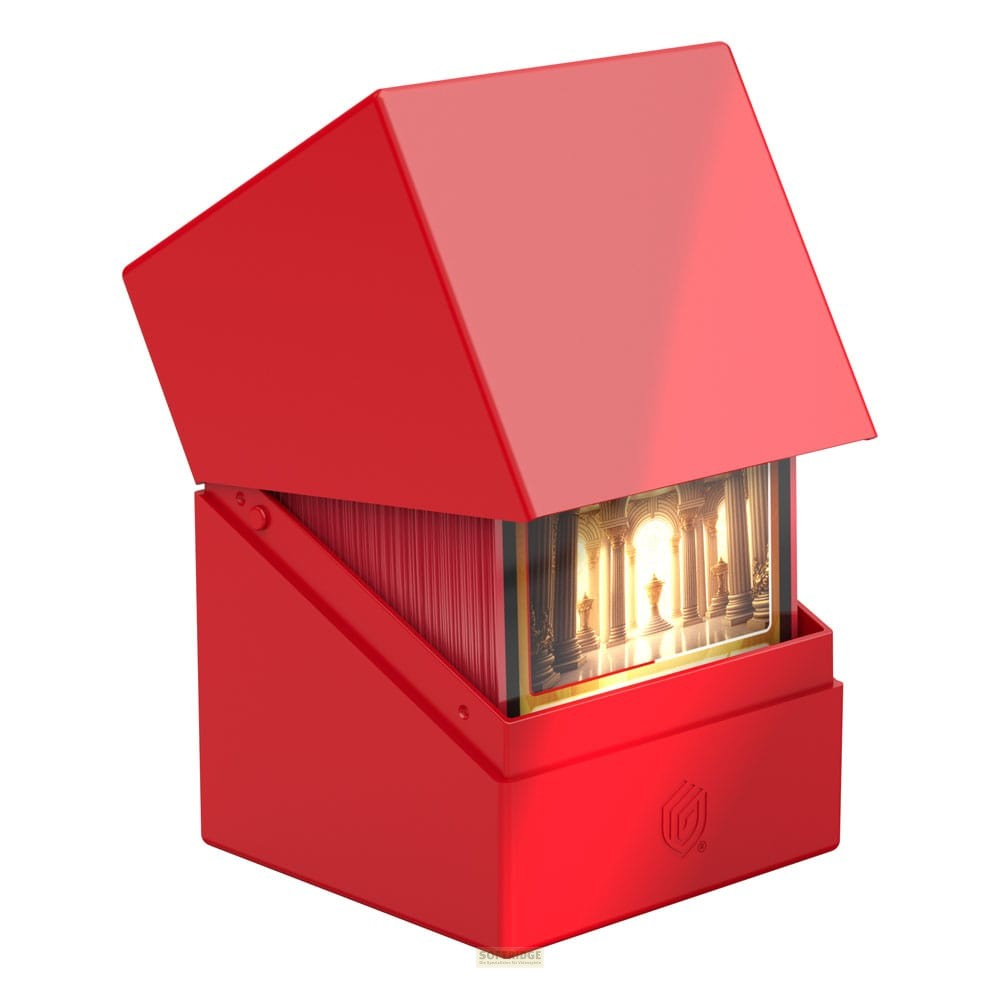 Une boîte à cartes rouge vif avec couvercle ouvert, remplie de cartes et une carte de temple doré à l'avant.