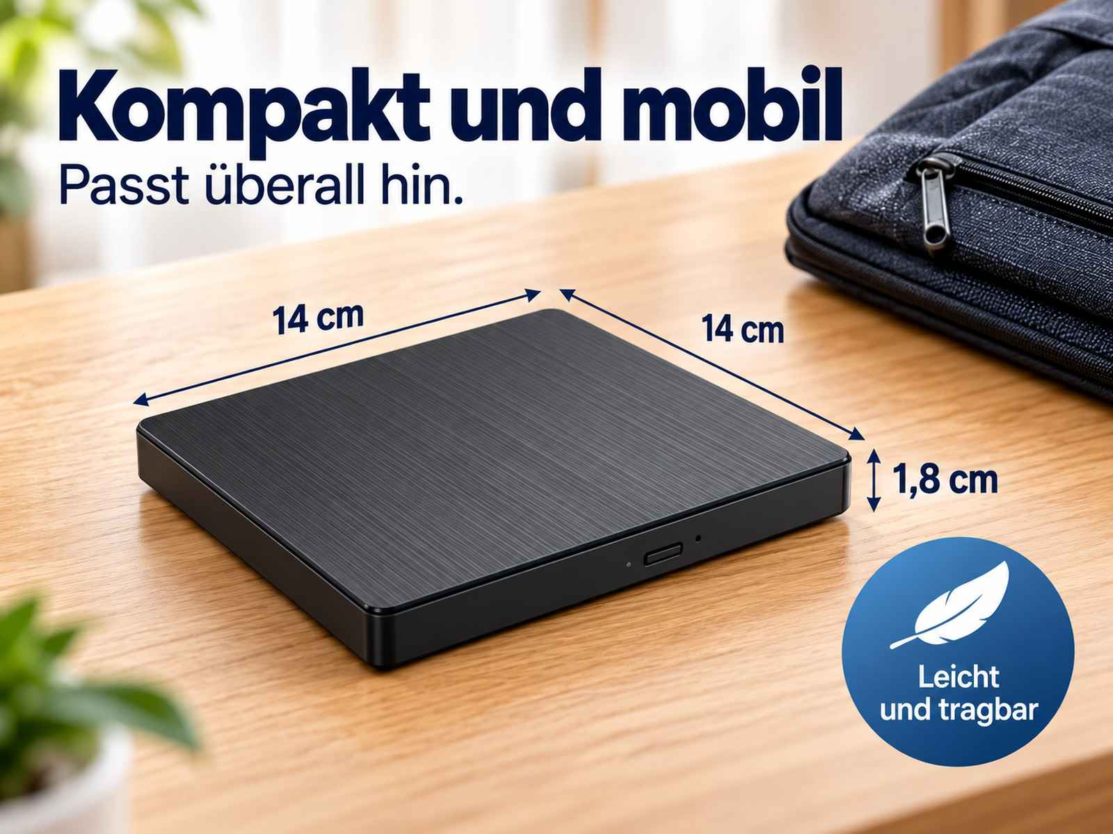 Schwarzes externes Laufwerk auf Holz Tisch mit Maßangaben und Text.
