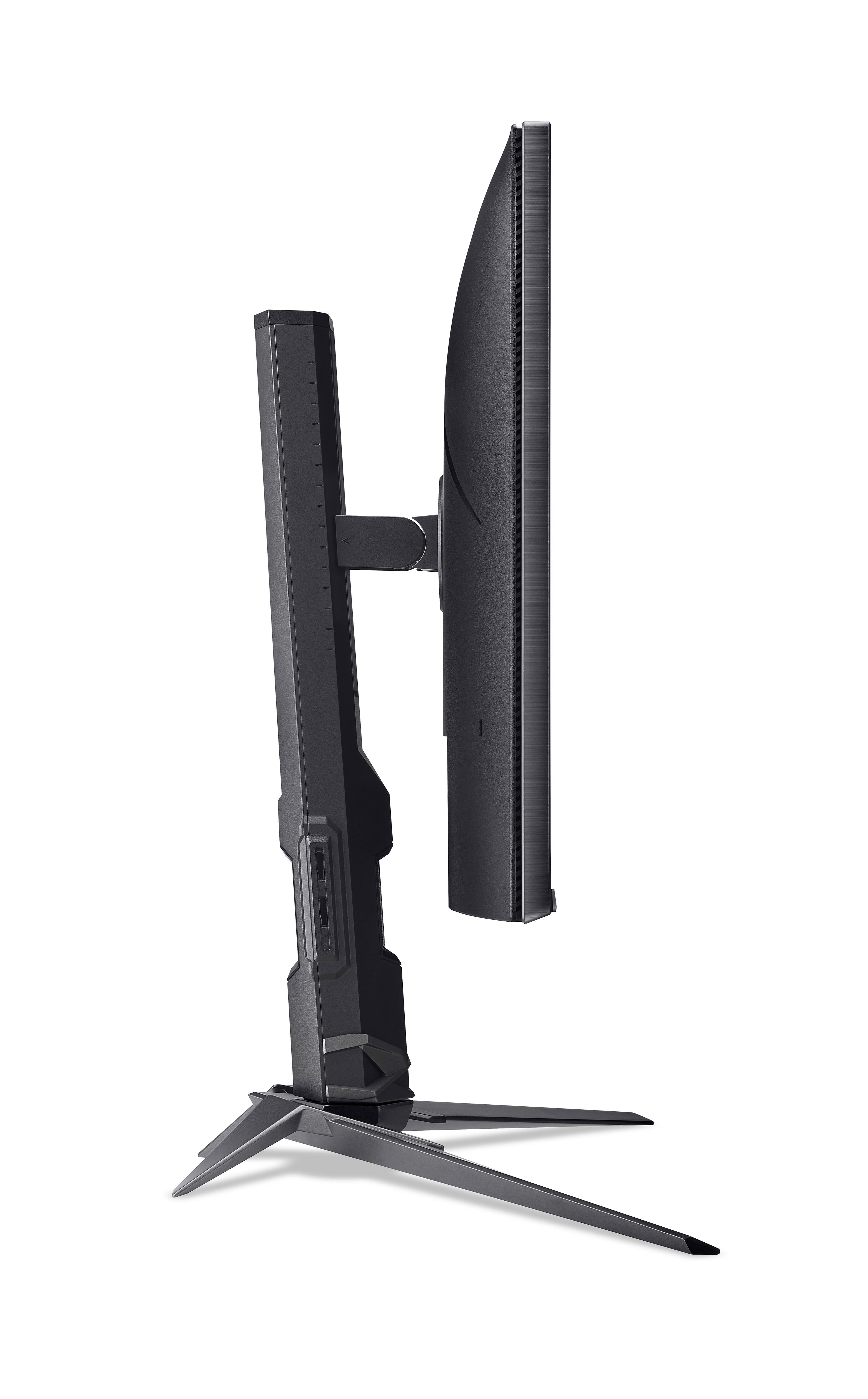 Vista laterale di un monitor per computer nero su supporto con pilastro verticale e base a treppiede su sfondo bianco.