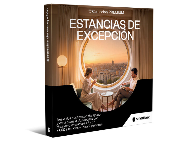 Una caja Smartbox de Estancias de Excepción con una pareja disfrutando de vistas a la ciudad desde una habitación.
