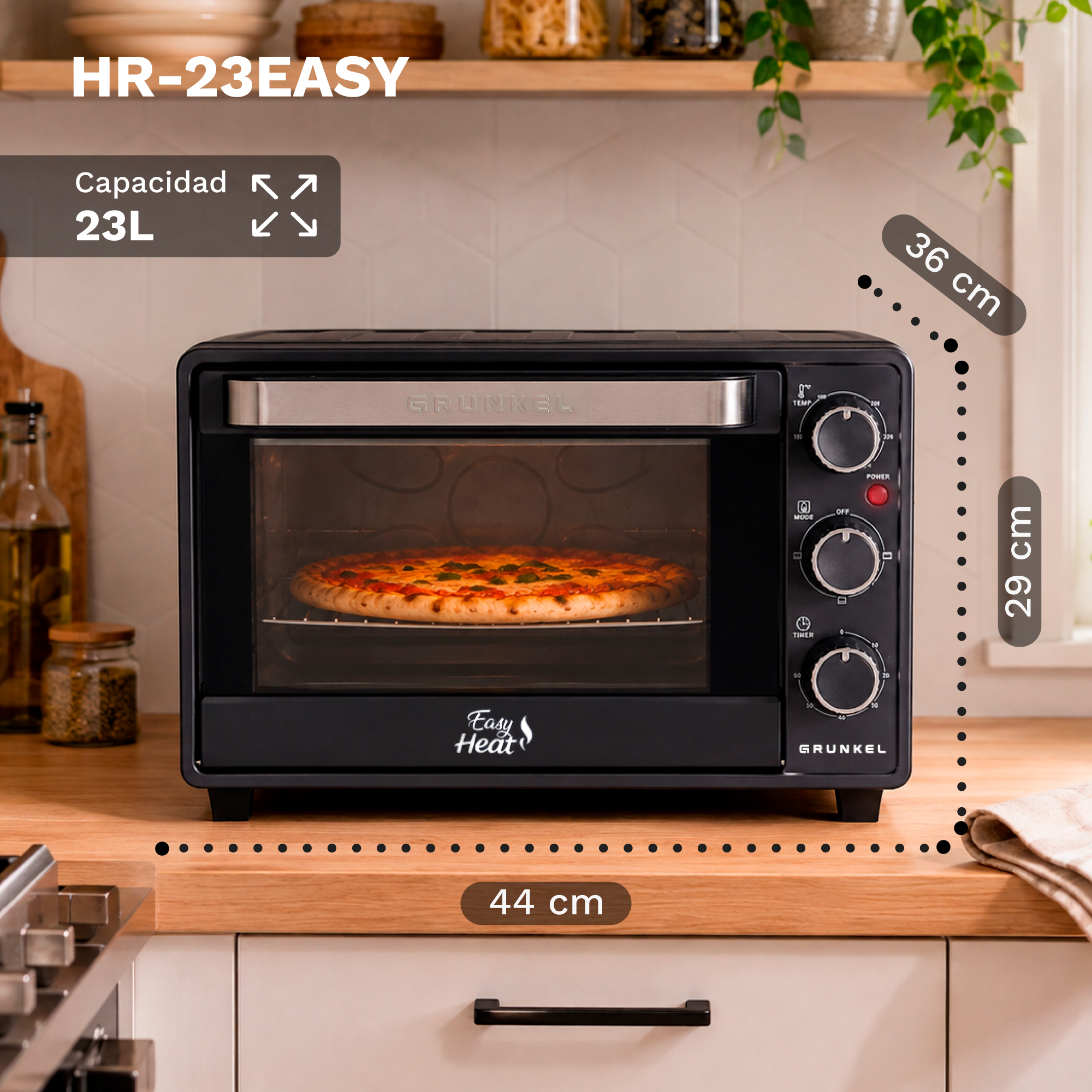 Mini horno negro Grunkel en una encimera de madera horneando una pizza, con dimensiones de 44x29x36 cm y 23L.
