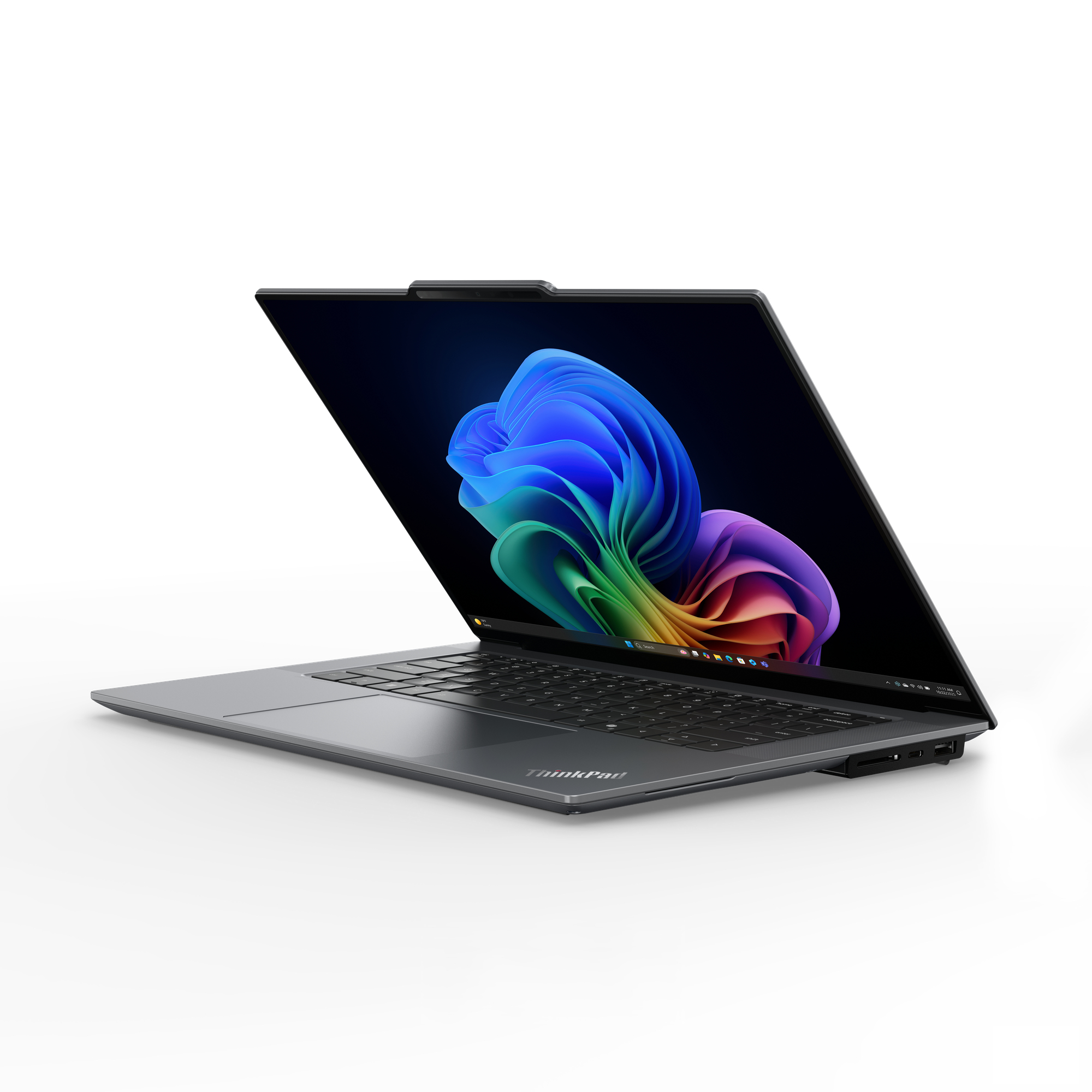 Een grijze ThinkPad-laptop open op een wit oppervlak met een kleurrijk, abstract bloemenbehang.