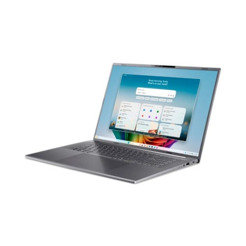 Un ordinateur portable gris posé sur une surface blanche affiche un écran coloré avec des widgets.