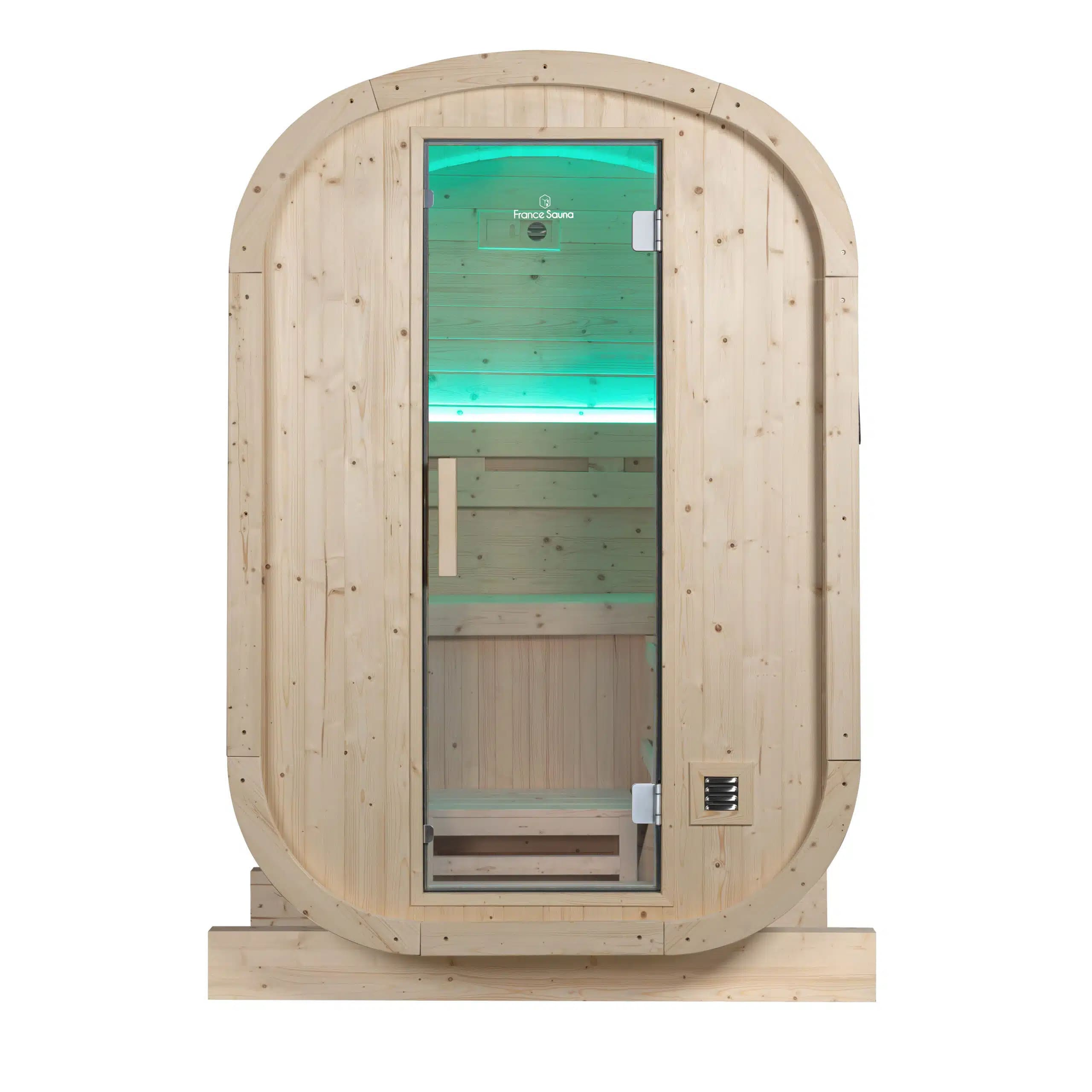 Sauna de barril de madera con puerta de vidrio y luz interior verde.