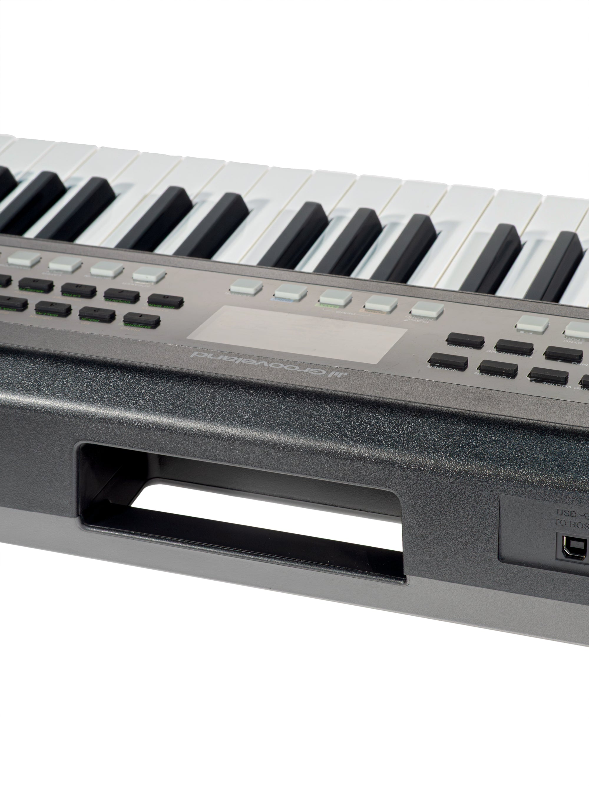 Nahaufnahme eines schwarzen E-Keyboards mit weißen und schwarzen Tasten, Bedienknöpfen, einem Display und Griff.